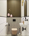 Cloakroom featuring Manhattan White Flat Matt Metro Wall Tiles 7.5cm x 30cm, paired with Carnaby Park Road Victorian style floor tiles, black and brass fittings, a floating basin and olive green fitted cabinetry.