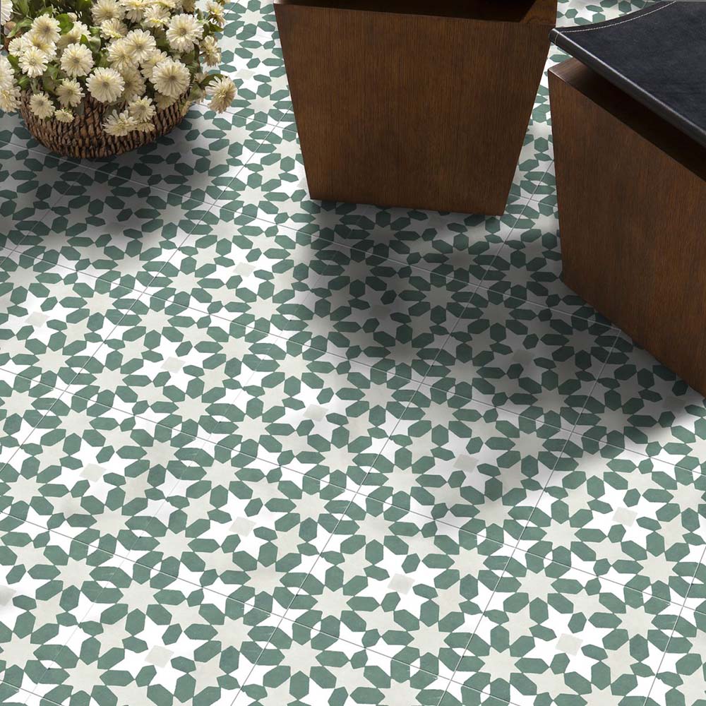 Marketing setting featuring Soukaina Green C Moroccan-style 20cm x 20cm patterned porcelain floor tiles, displaying an all-over geometric star pattern in soft green and white tones with a matt finish.