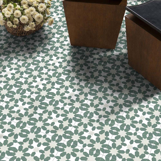 Marketing setting featuring Soukaina Green C Moroccan-style 20cm x 20cm patterned porcelain floor tiles, displaying an all-over geometric star pattern in soft green and white tones with a matt finish.