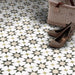 Agraba Natural 20x20cm Moroccan floor tiles in a geometric star pattern with soft beige, taupe, and olive tones, styled in an entryway with woven basket and glitter shoes for a warm, neutral look.