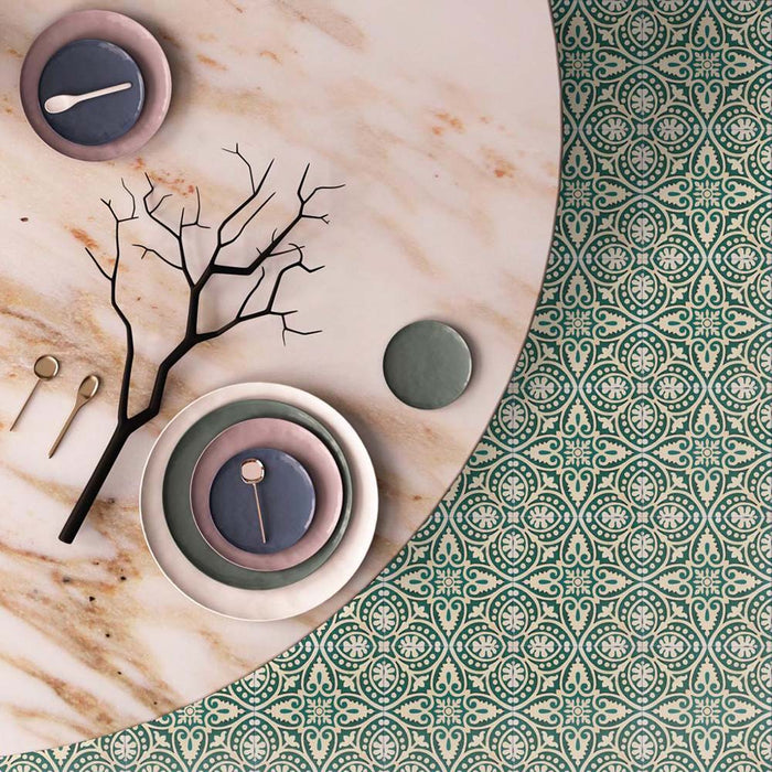 Cabana Flowers Moroccan Style 20x20cm porcelain tiles in a marketing setting, featuring an intricate floral and leaf pattern in deep green and cream tones with a smooth matt finish, styled beside a marble tabletop with modern crockery and gold cutlery.