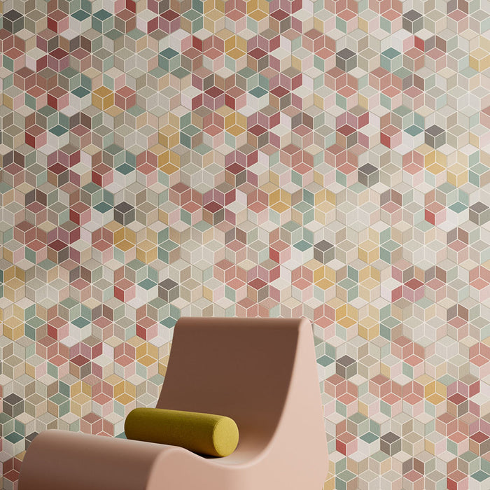 Interior setting featuring Candy Colours multicoloured hexagon patchwork Moroccan-style porcelain tiles in a 17x15cm format, showcasing a playful mix of pastel tones, styled with a modern chair.