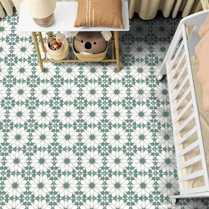 Marketing setting featuring Soukaina Green D Moroccan-style 20cm x 20cm patterned porcelain floor tiles, showcasing a repeating geometric star design in soft green and white tones with a matt finish, styled in a bright family-friendly interior.