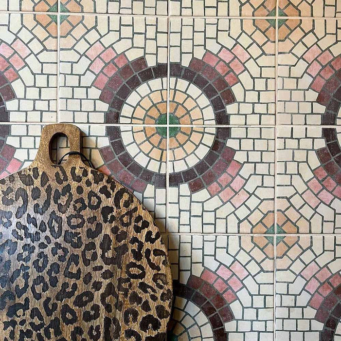 Kitchen wall featuring Cabana La Calle 20x20cm Moroccan-style ceramic tiles in a mosaic-effect circular pattern, styled with a leopard-print wooden chopping board.