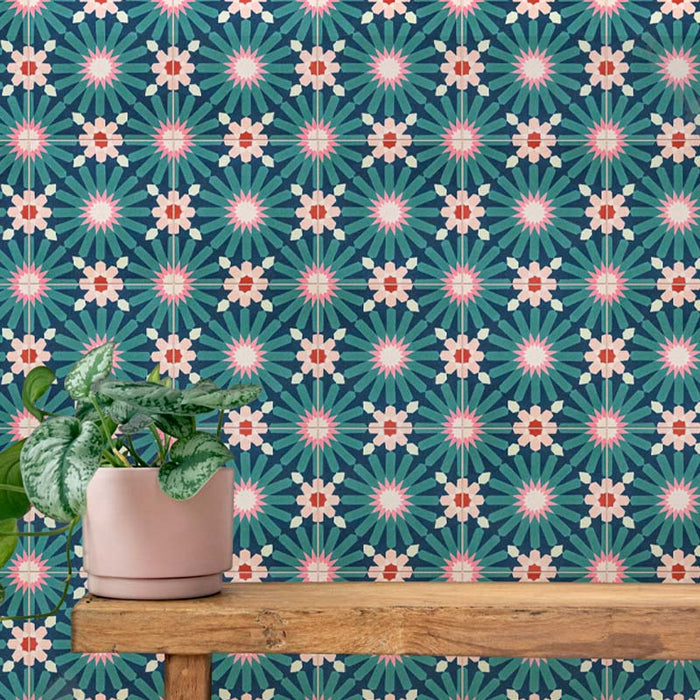 Interior setting featuring Fizaan Festive Blue Mini 15x15cm Moroccan-style porcelain tiles, showcasing a repeating geometric pattern in rich blue and green tones, styled with a wooden shelf and potted plant.