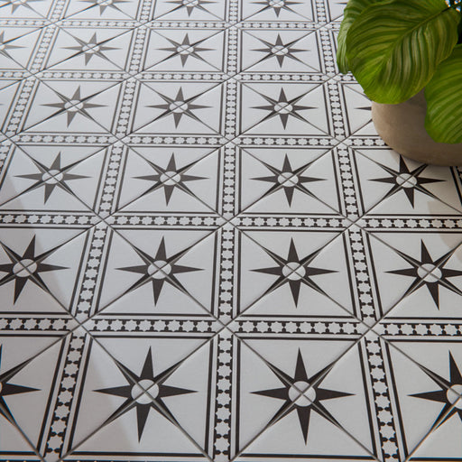 Galata White Moroccan style 20x20cm patterned tiles, used as a floor installation to create a crisp white and black geometric star feature.
