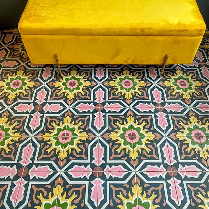 Interior featuring Cabana Havana 20x20cm Moroccan-style ceramic floor tiles in a multicolour floral geometric pattern, styled with a mustard yellow velvet bench.