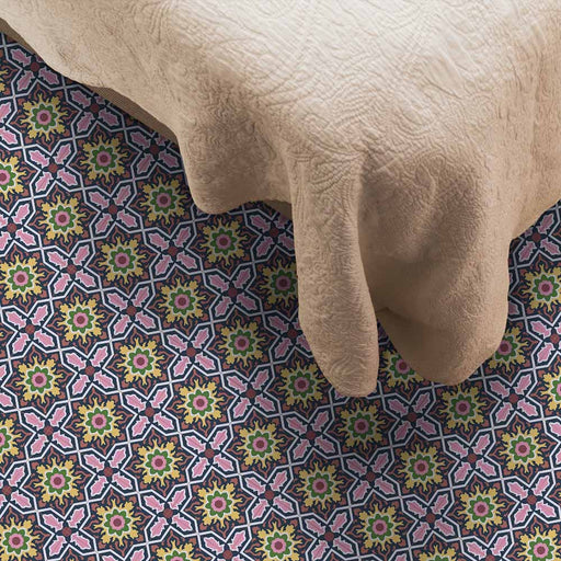 Bedroom featuring Cabana Havana Mini 15x15cm Moroccan-style ceramic floor tiles in a multicolour floral geometric pattern, styled with a beige quilted bedspread.