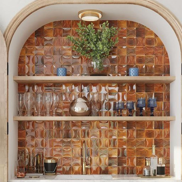 Kitchen alcove featuring Beijing Amber Decor Square 10x10cm Moroccan-style ceramic wall tiles, styled with wooden shelving, gold fittings and glassware for a warm, elegant look.