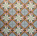 Cabana Star Mini 15x15cm Moroccan-style ceramic tiles in a multicolour geometric star pattern, shown in a marketing display setting.