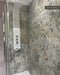 Shower featuring Milano Warm Stone Matt 60cm x 120cm porcelain wall tiles, showcasing a dramatic stone effect design with layered grey, cream, beige and charcoal tones alongside a modern rainfall shower.