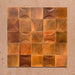 Beijing Amber Square 10x10cm Moroccan-style ceramic wall tiles mixed with Beijing Amber Decor Square tiles, styled in a grouped layout to highlight their curved relief design and rich amber glaze.