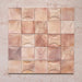 Beijing Rose Pink Square 10x10cm Moroccan-style ceramic wall tiles mixed with Decor Square tiles, styled in a grouped layout to highlight their curved relief pattern and soft pink glaze.