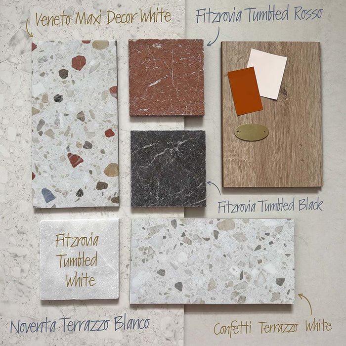 Flat lay moodboard featuring Fitzrovia White 15.2x15.2cm tumbled natural marble tile alongside coordinating Rosso and Black marble, terrazzo surfaces, and wood textures, showcasing complementary tones, materials, and interior design pairing ideas.