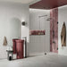 Contemporary bathroom featuring Noventa Blanco 3D Terrazzo 60x120cm porcelain wall tiles, showcasing a white terrazzo effect with textured 3D stone chips, paired with a burgundy feature basin, pink gloss shower tiles, black fittings and a frameless walk-in shower.