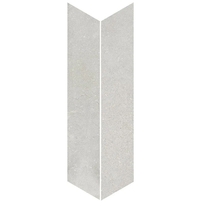 Product display of Obsidian Stone Chevron Silver 10x53cm stone-effect porcelain chevron tiles in soft silver-grey tones, featuring subtle veining, textured detailing and a realistic natural stone appearance with a matt finish.