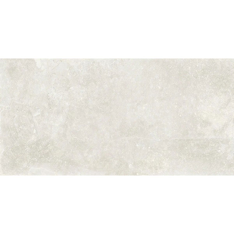 Product display of Obsidian Stone Silk 30x60cm stone-effect porcelain tiles in soft light grey tones, featuring subtle texture, gentle tonal variation and a realistic natural stone appearance with a matt finish.