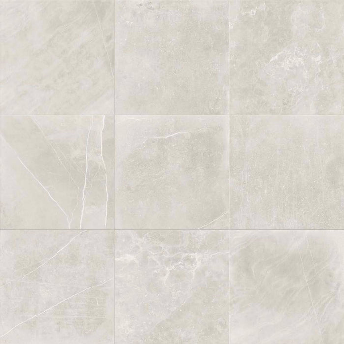 Product display of Obsidian Stone Silver 60x60cm stone-effect porcelain tiles in soft silver-grey tones, featuring subtle veining, textured detailing and a realistic natural stone appearance with a matt finish.