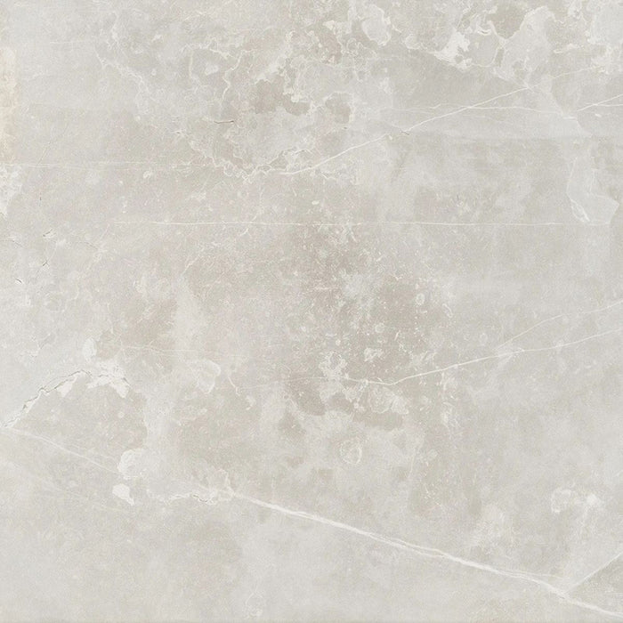 Product display of Obsidian Stone Silver 60x60cm stone-effect porcelain tiles in soft silver-grey tones, featuring subtle veining, textured detailing and a realistic natural stone appearance with a matt finish.