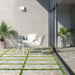 Outdoor patio featuring Boheme Ocean Blend 2cm 50 × 100cm patterned porcelain slabs, laid with grass joints to soften the look. Subtle blue and beige aged-effect tones create a relaxed, natural feel, ideal for contemporary outdoor spaces.