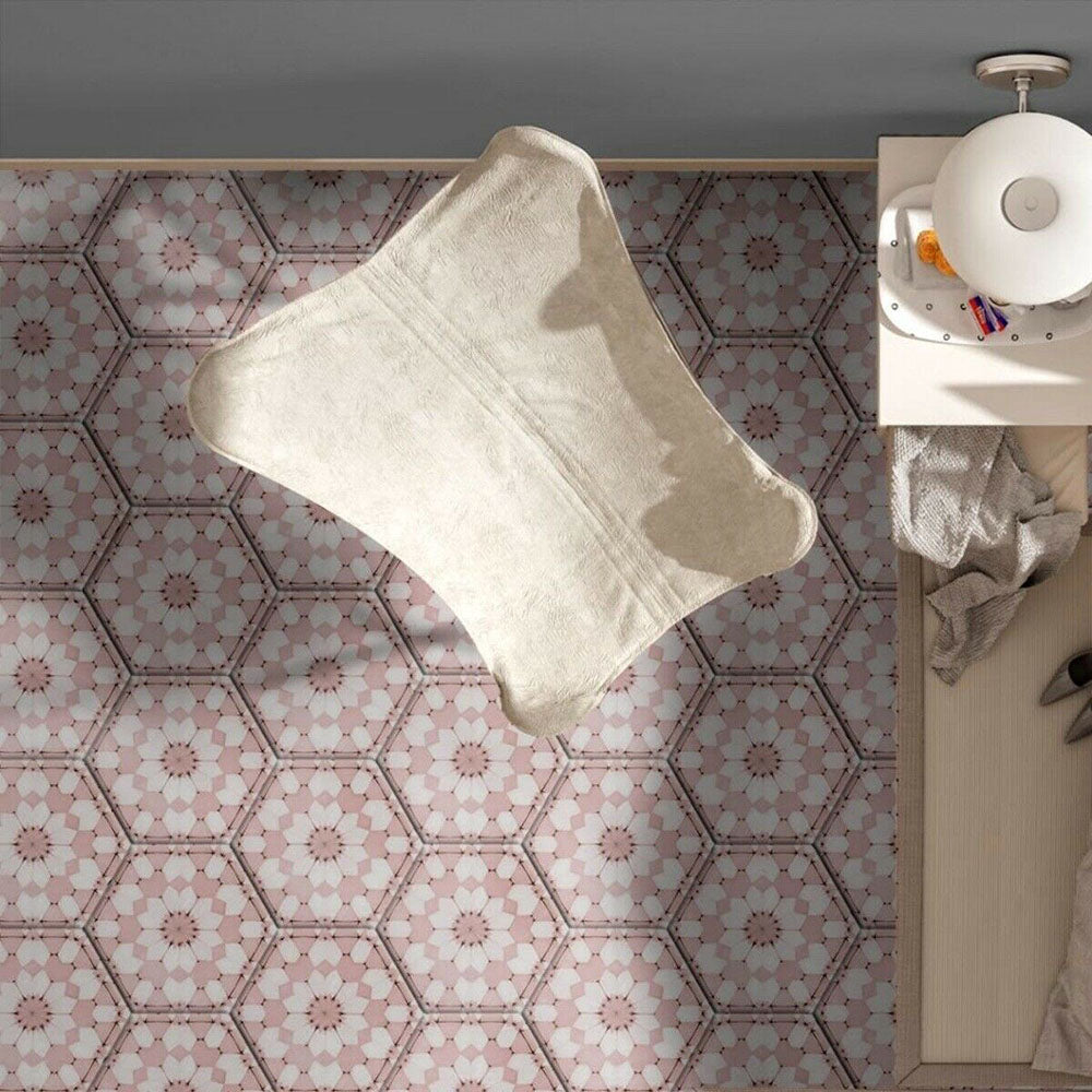 Maroush Dusty Pink 18.7x21.6cm Moroccan hexagonal tiles featuring a soft pink and white geometric floral pattern, styled in a modern home office with a cream rug and neutral décor.