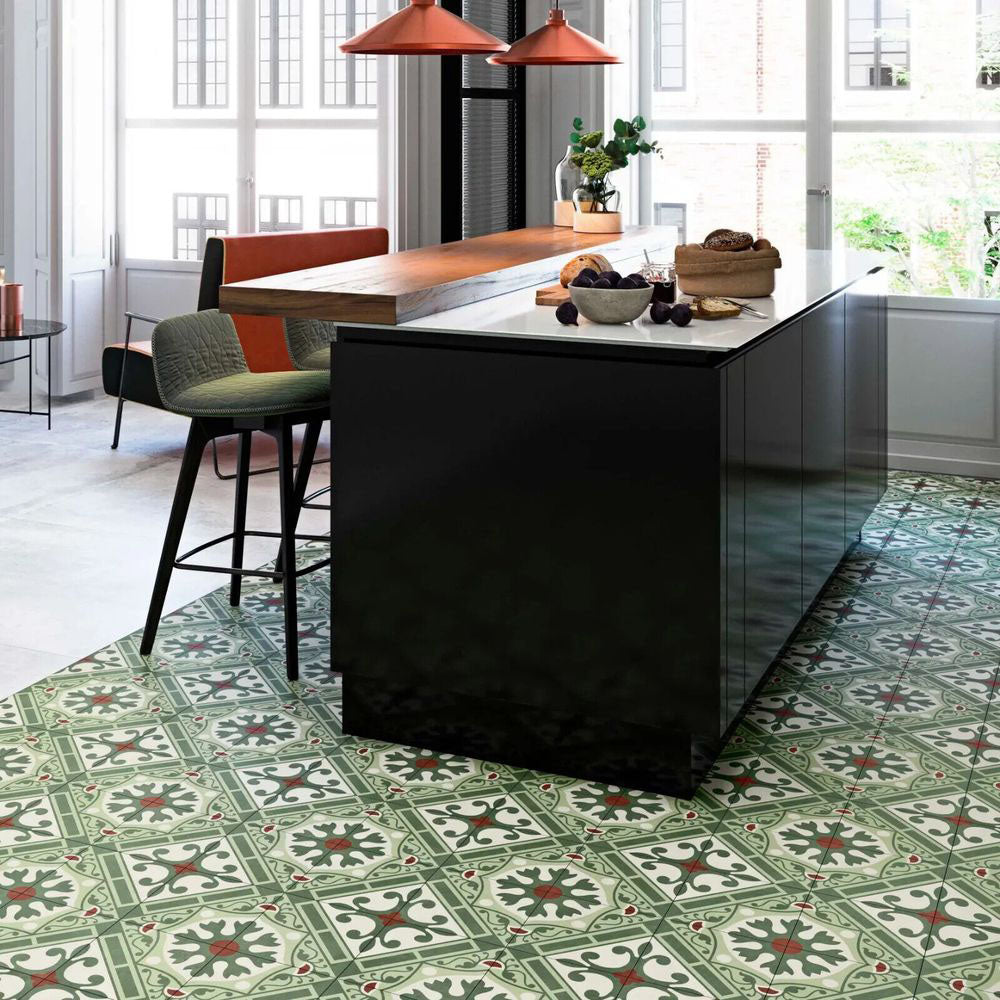 Contemporary kitchen featuring Palma Corfu 2cm patterned outdoor slabs 50 × 100cm, showcasing a decorative Mediterranean-inspired pattern in green, cream, and terracotta tones, paired with sleek black cabinetry and warm wood accents.