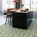 Contemporary kitchen featuring Palma Corfu 2cm patterned outdoor slabs 50 × 100cm, showcasing a decorative Mediterranean-inspired pattern in green, cream, and terracotta tones, paired with sleek black cabinetry and warm wood accents.