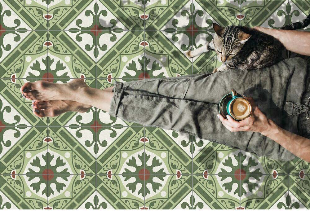 Close-up of Palma Corfu 2cm patterned outdoor slabs 50 × 100cm, featuring a decorative Mediterranean-inspired pattern in green, cream, and terracotta tones with a vintage-style finish and geometric detailing.