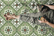Close-up of Palma Corfu 2cm patterned outdoor slabs 50 × 100cm, featuring a decorative Mediterranean-inspired pattern in green, cream, and terracotta tones with a vintage-style finish and geometric detailing.