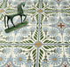 Close-up of Palma Olbia 2cm patterned outdoor slabs 50 × 100cm, featuring a faded Mediterranean-inspired floral design in soft green, blue, and terracotta tones with a decorative vintage-style finish.