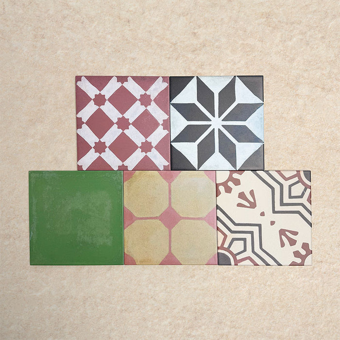 Fihrdos Patchwork Moroccan-style 20x20cm patterned porcelain tiles arranged in a mini group, highlighting a selection of colourful geometric and traditional decorative designs.