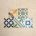 Fihrdos Patchwork Moroccan-style 20x20cm patterned porcelain tiles arranged in a mini group, highlighting a selection of colourful geometric and traditional decorative designs.