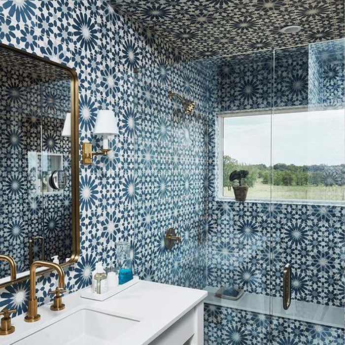 Patchwork marketing setting featuring Soukaina Blue D Moroccan-style 20cm x 20cm patterned porcelain tiles, combining geometric star motifs in blue, white and soft neutral tones across bathroom walls and ceiling for a bold Moroccan-inspired look.