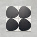 Pebble Beach Reversed Black 20x20cm patterned tiles featuring a bold black organic circular design, ideal for creating striking monochrome floors and statement walls with a contemporary geometric aesthetic.