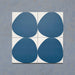Pebble Beach Reversed Blue 20x20cm patterned tiles featuring a bold deep blue organic circular design, ideal for creating playful statement walls and contemporary patterned floors with a modern geometric feel.