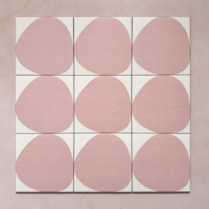 Pebble Beach Reversed Pink 20x20cm patterned tiles featuring a soft blush pink organic circular design, perfect for adding a playful yet minimalist look to bathrooms, kitchens, and statement floors.