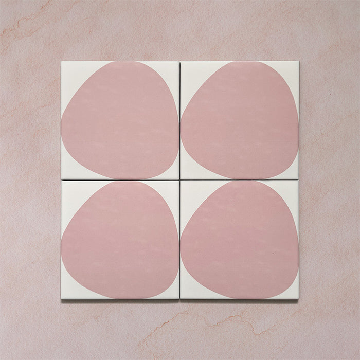 Pebble Beach Reversed Pink 20x20cm patterned tiles featuring a soft blush pink organic circular design, perfect for adding a playful yet minimalist look to bathrooms, kitchens, and statement floors.