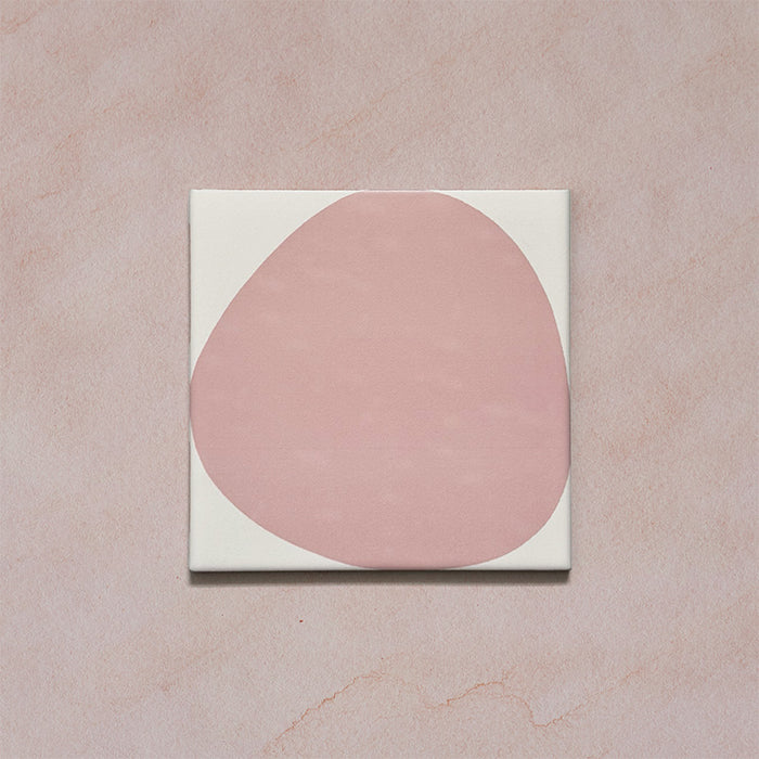 Pebble Beach Reversed Pink 20x20cm patterned tiles featuring a soft blush pink organic circular design, perfect for adding a playful yet minimalist look to bathrooms, kitchens, and statement floors.