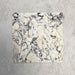 Grouped Fitzrovia Picasso 5 x 20cm honed natural marble tiles arranged together to showcase the overall variation of the range, featuring a light base with bold, expressive veining in deep charcoal, soft green, and warm golden tones, highlighting the natural character of the stone across multiple pieces.