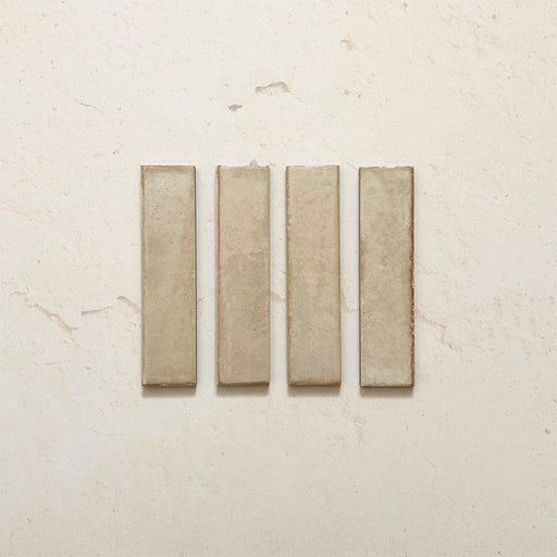 Product image of Play Cream Rectified Brick 5x20cm wall and floor tiles, featuring a glossy cream finish with subtle tonal variation and clean rectified edges, displayed to highlight the tile's contemporary handcrafted appearance.