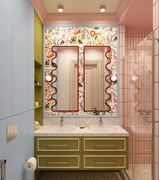 Bathroom interior featuring Rippled Brick Base Stony Pink 5 × 20cm matt ceramic wall tiles, laid vertically with fine linear detail, paired with a glass shower enclosure, terrazzo-effect flooring, and a playful, colour-led vanity area.
