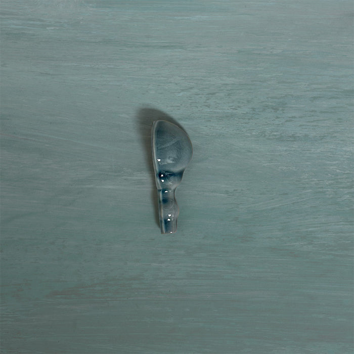 Detail view of Finchley River Blue ceramic external corner trim with a crackle glaze finish, designed to create a smooth, decorative transition and a polished edge in classic wall tile installations.