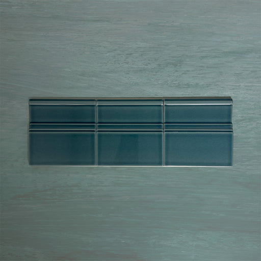 Flat lay of Finchley River Blue 15 × 15cm ceramic skirting tiles with a crackle glaze finish, designed to create a smooth, decorative transition between wall and floor in classic interior spaces.