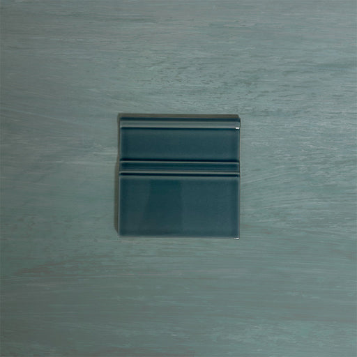 Finchley River Blue 15 × 15cm ceramic skirting tile with a crackle glaze finish, designed to create a smooth, decorative transition between wall and floor in classic interior spaces.