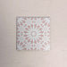 Single Fizaan Pink Rose 20x20cm Moroccan-style porcelain tile featuring a delicate geometric pattern in soft pink and white tones.
