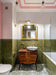 Bathroom featuring Sakura Olivio 20x20cm Moroccan-style patterned floor tiles, paired with glossy olive green wall tiles, vintage wood cabinetry, and brass fixtures for an eclectic, characterful interior.