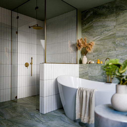 Bathroom featuring Malaga White Sand Brick gloss ceramic wall tiles in a 6.5 × 32.8cm format, laid vertically around the shower and bath for a clean, contemporary finish.