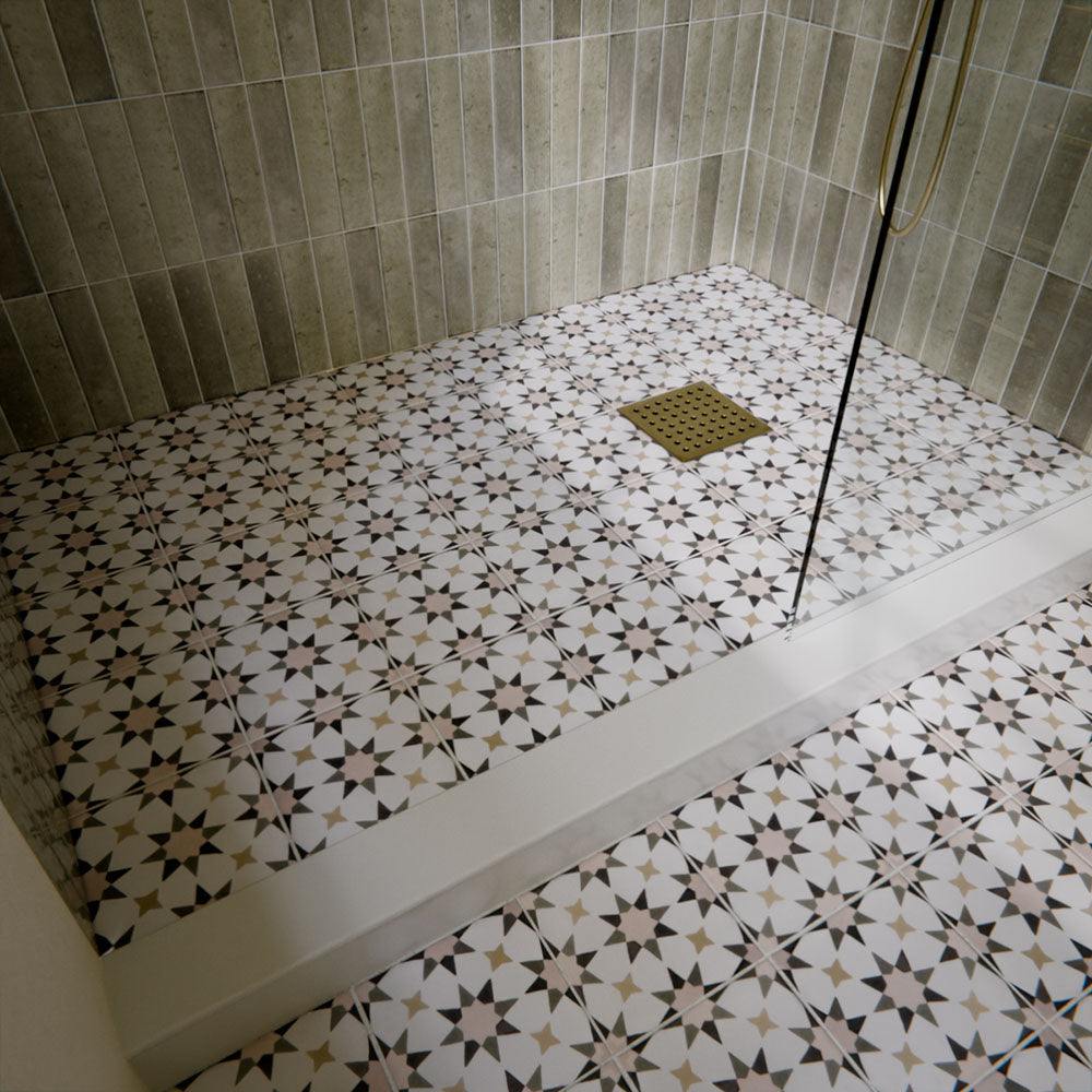 Shower floor featuring Agraba Natural 20×20cm Moroccan-style patterned tiles in soft neutral tones, laid to create a subtle geometric pattern that adds warmth, texture and visual interest to the bathroom.