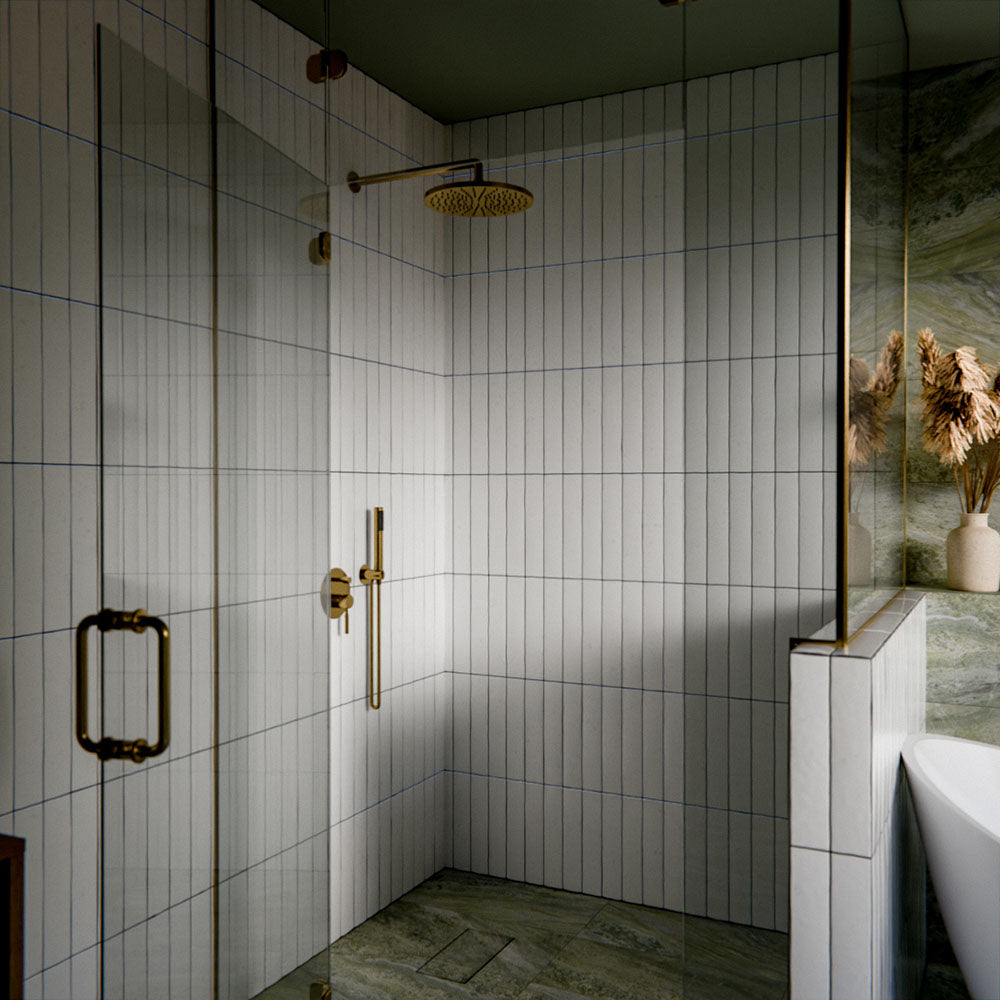 Bathroom featuring Malaga White Sand Brick gloss ceramic wall tiles in a 6.5 × 32.8cm format, laid vertically around the shower and bath for a clean, contemporary finish.