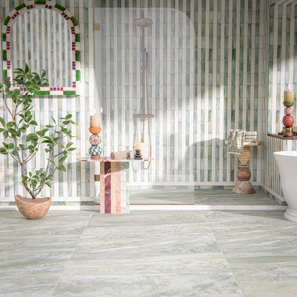 Bathroom setting featuring Paradis Marble Verde 60x120cm marble effect floor tiles, showcasing soft green tones with natural veining, paired with vertically laid brick wall tiles and organic styling for a calm, spa-inspired finish.